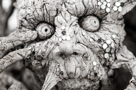 WAT RONG KHUN - WHITE TEMPLE, CHIANG RAI THAILAND - CIRCA MAY 2018. Closeup detail of metamorphic...