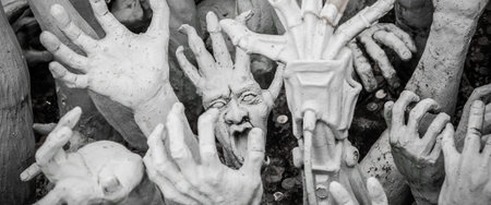 WAT RONG KHUN - WHITE TEMPLE, CHIANG RAI THAILAND - CIRCA MAY 2018. The sculpture of hundreds...