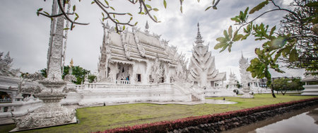 WAT RONG KHUN - WHITE TEMPLE, CHIANG RAI THAILAND - CIRCA MAY 2018. Contemporary Buddhist religious temple. Buddhism architectureのeditorial素材