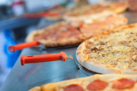 Slice of margarita pizza on scapula. Tasty fast food italian traditional
