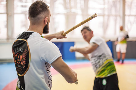 PLOVDIV, BULGARIA - 15. DECEMBER 2018. Kapap students practice sticks fighting techniques training...