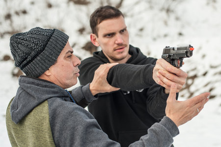Pozarevac, Serbia - December 21-24, 2018: Kapap Instructor Avi Nardia teaches his students on the shooting range GROM, how to safely use the gun on KAPAP BASIC FIREARMS SAFETY AND GUN USE SEMINARのeditorial素材