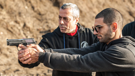 Pozarevac, Serbia - December 21-24, 2018: Kapap Instructor Avi Nardia teaches his students on the shooting range GROM, how to safely use the gun on KAPAP BASIC FIREARMS SAFETY AND GUN USE SEMINARのeditorial素材