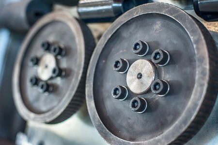 Close up detail view of mechanical nut transport system in industrial factoryの写真素材