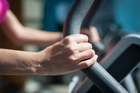 Closeup of woman using stepper and training in fitness center. Power fitness, sport, training, lifestyleの写真素材