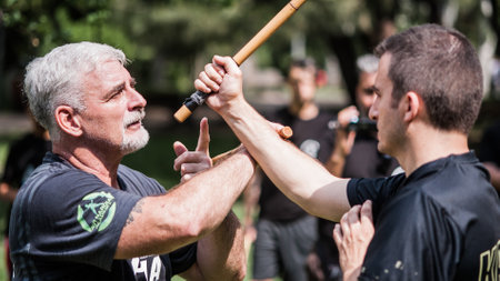 ISTANBUL, TURKEY - Maj 30 - Jun 02. 2019. Kapap instructor Fabian Garcia from Argentina, demonstrates escrima stick fighting to large group of students on GENERAL MEETING OF KAPAP INSTRUCTORSのeditorial素材