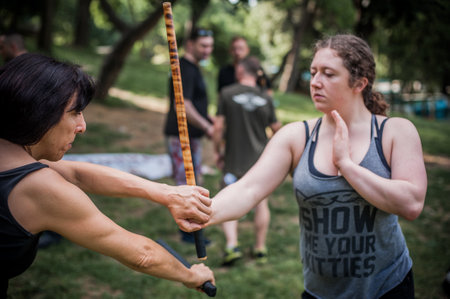 ISTANBUL, TURKEY - Maj 30 - Jun 02. 2019. Group of martial arts students practice filipino escrima stick fighting on GENERAL MEETING OF KAPAP INSTRUCTORS. Outdoor trainingのeditorial素材
