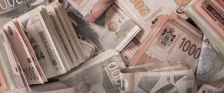 BELGRADE, SERBIA â 9. SEPTEMBER 2019. Different money bills stacked over each other forming a money background. Day editorial shotのeditorial素材