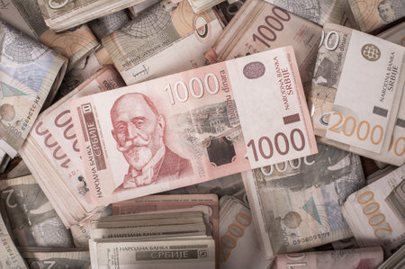 BELGRADE, SERBIA â 9. SEPTEMBER 2019. Different money bills stacked over each other forming a money background. Day editorial shotのeditorial素材