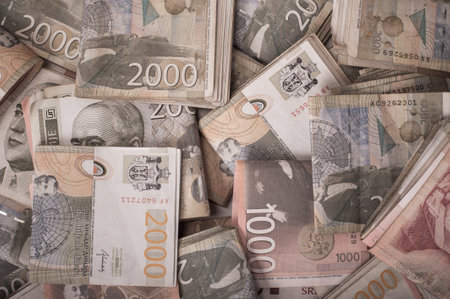BELGRADE, SERBIA â 9. SEPTEMBER 2019. Different money bills stacked over each other forming a money background. Day editorial shotのeditorial素材