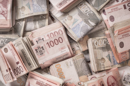 BELGRADE, SERBIA â 9. SEPTEMBER 2019. Different money bills stacked over each other forming a money background. Day editorial shotのeditorial素材