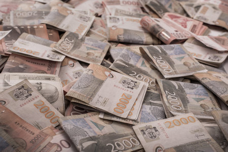 BELGRADE, SERBIA â 9. SEPTEMBER 2019. Different money bills stacked over each other forming a money background. Day editorial shotのeditorial素材