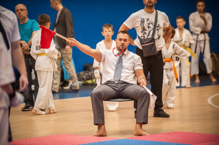 BELGRADE, SERBIA - 28. SEPTEM BER 2019. International Tournament judge referee with flags on Karate Kyokushin Competition Fight on Kyokushin Belgrade Trophy at Sport Center RADIVOJE KORACのeditorial素材