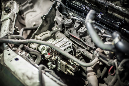 Car master auto mechanic repairer service technician checks and repairs the engine condition under...