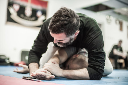 BELGRADE, SERBIA - 15. DECEMBER 2019. Sensei master instructor Avi Nardia explains Knife Threat Self...