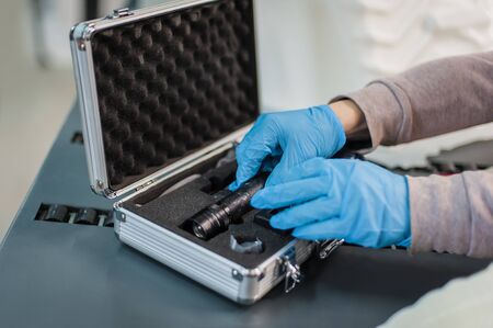 Technicians use UV lamp light for curing resin 3d print printed on modern 3d printer machineの写真素材