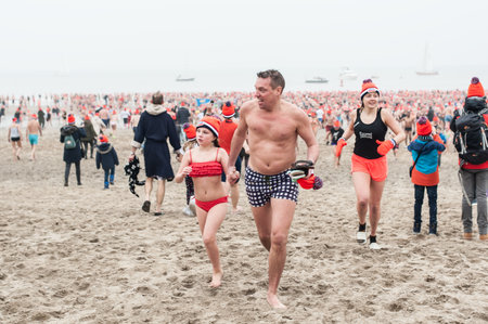 SCHEVENINGEN, NETHERLANDS â 01. January 2020. Scheveningen annual new yearâs dive and swim. Typical Dutch traditionのeditorial素材