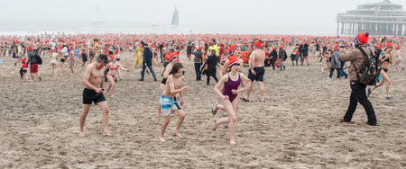 SCHEVENINGEN, NETHERLANDS â 01. January 2020. Scheveningen annual new yearâs dive and swim. Typical Dutch traditionのeditorial素材