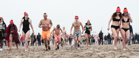 SCHEVENINGEN, NETHERLANDS â 01. January 2020. Scheveningen annual new yearâs dive and swim. Typical Dutch traditionのeditorial素材