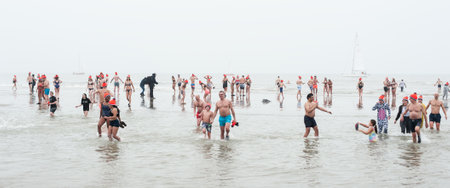 SCHEVENINGEN, NETHERLANDS â 01. January 2020. Scheveningen annual new yearâs dive and swim. Typical Dutch traditionのeditorial素材