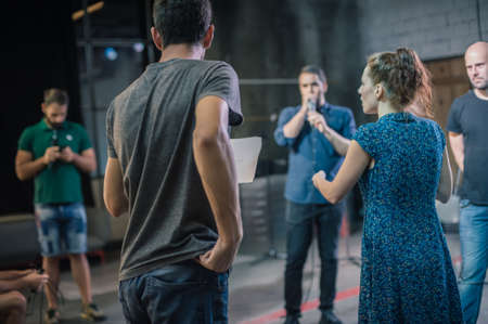 Behind the scene. Director of the play rehearses the play with the actors according to the scriptの写真素材