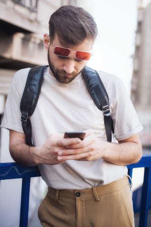 Man using smart phone connect communication. Young people addiction to new technology trends. Youth, new generation internet friendship concept. Emotional isolation and depresionの写真素材