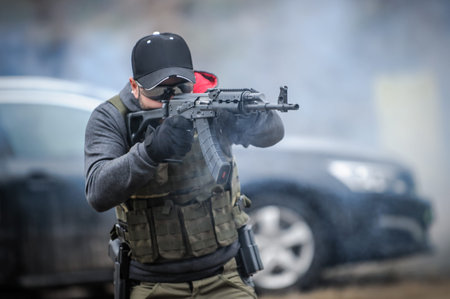 Military army soldier in action tactical combat shooting from rifle machine gun. Shooting and...
