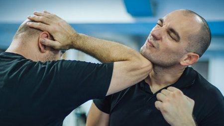 Sparring training and demonstration of street fight technique against attacker in dojo gym. Martial arts practiceの写真素材