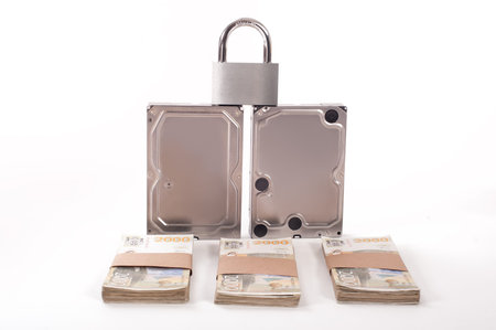 Cyber crime. Internet cyber security concept with a padlock on computer hard disc. Ransomware,...