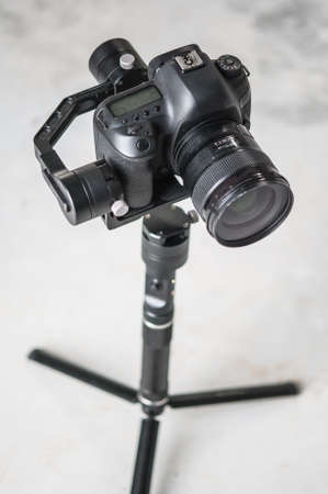 Movie camera on tripod. Professional digital equipment recording in studio, focus on cameraの写真素材