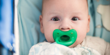 Portrait view of cute peaceful baby. Love and family emotion