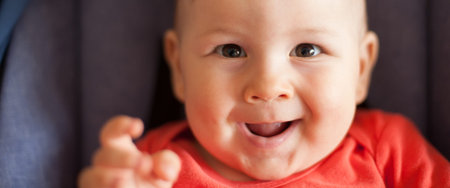 Portrait of cute happy baby boy looking at camera. Joy and happiness concept. Love and family...