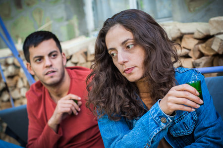 Very drunk couple in quarrel conflict. Relationships and social problems in youth culture. Alcoholism conceptの写真素材