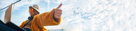 Body Language, Thumb Up Gesture. Influencer girl gesturing success showing V for victory, on terrace...