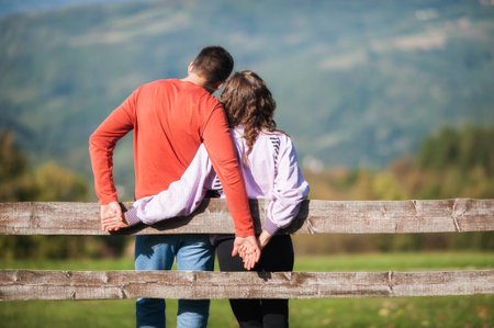 Falling in love. Romantic couple hugging and enjoying in love in country village in nature outdoor. Love, relationship and romance concept. Girlfriend and boyfriend datingの写真素材