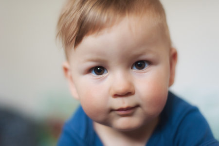 Cute baby boy looking at camera. Close-up detail front view. Love and family conceptの写真素材