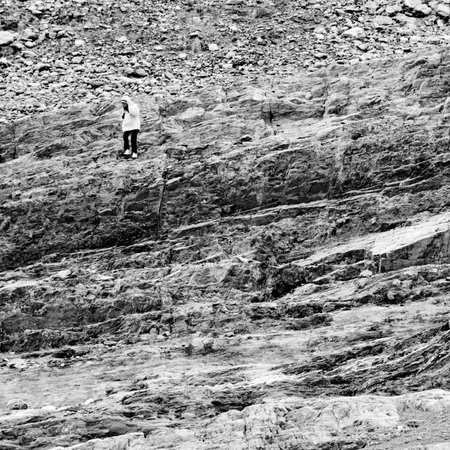 Woman walking down a stone staircaseの写真素材