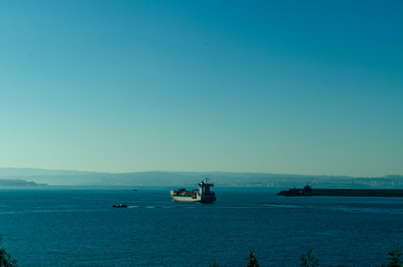 In the photograph you can see a container ship leaving the outer port of Ferrolの写真素材