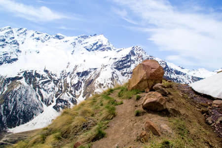large stone against a blurred background of mountainsの写真素材