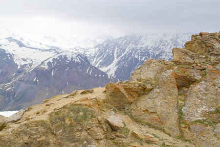 large stone against a background of mountains