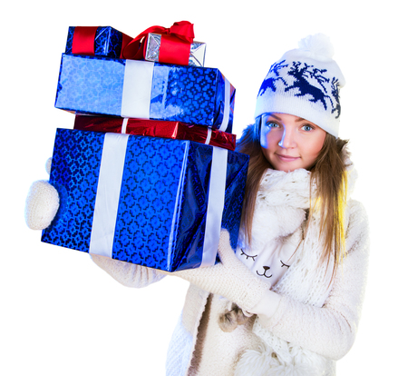 Christmas Woman. Beautiful New Year and Christmas Gift Holiday Hairstyle and Make up. Beauty Girl with Colorful Makeup, Hair, Gift and Accessories. Happy and funny Woman. Emotions. White backgroundの写真素材