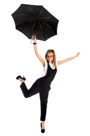 young girl in a business suit and carrying an umbrella in his hand on a white backgroundの写真素材