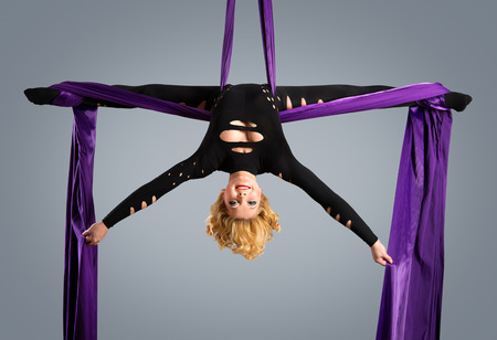 Beautiful dancer on aerial silk aerial contortion aerial ribbons aerial silks aerial tissues fabric ribbon tissueの写真素材