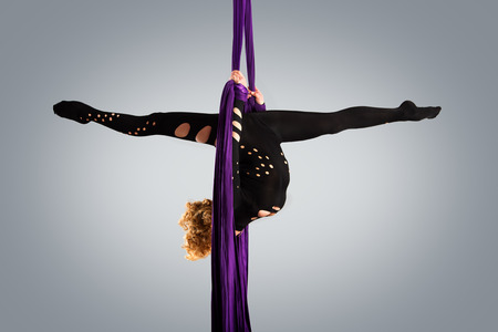 Beautiful dancer on aerial silk aerial contortion aerial ribbons aerial silks aerial tissues fabric ribbon tissueの写真素材