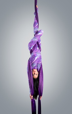 Beautiful dancer on aerial silk aerial contortion aerial ribbons aerial silks aerial tissues fabric ribbon tissueの写真素材