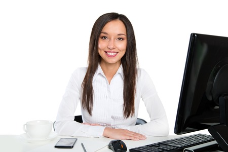Portrait of a young business woman using computer at officeの写真素材