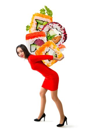Young beautiful woman carries sushi on a white backgroundの写真素材
