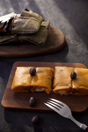 Typical dish of Peru known by the name of tamales, made with corn flour, chicken or pork, garlic, chili, black olives and egg.の写真素材