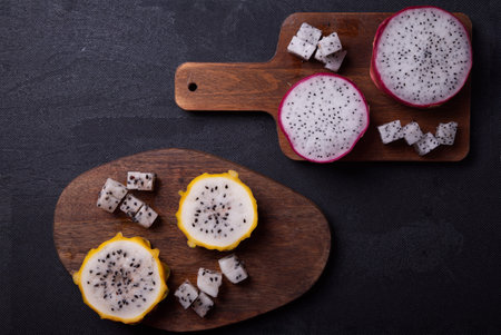 Dragon fruits cut out and exposed on dark backgroundsの写真素材