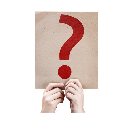 Hands holding cardboard with a question mark symbol on white background